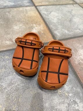 CROCS Kids Basketball-Pattern Clog Sandals in Orange with Black Accents